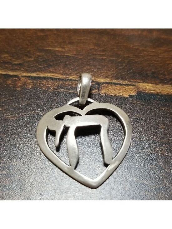 Jewelry - Sterling silver pendant, stamped 925,about an inch wide.